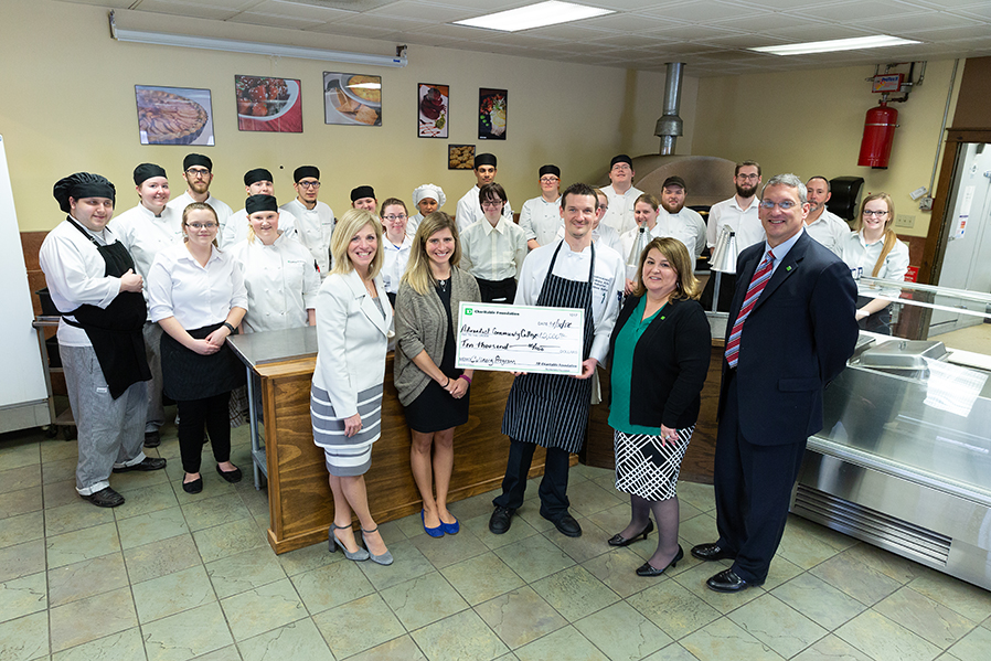 SUNY Adirondack President Kristine Duffy; Culinary Arts instrutors Megan Diehl and Matthew Bolton; TD Bank Vice President, Field Marketing Manager, Fran Yanulavich; TD Bank Regional Vice President James Gaspo; and students from the SUNY Adirondack Culinary Arts program pose during a recent luncheojn marking TD Bank's $10,000 gift to support the college's Culinary Arts expansion.