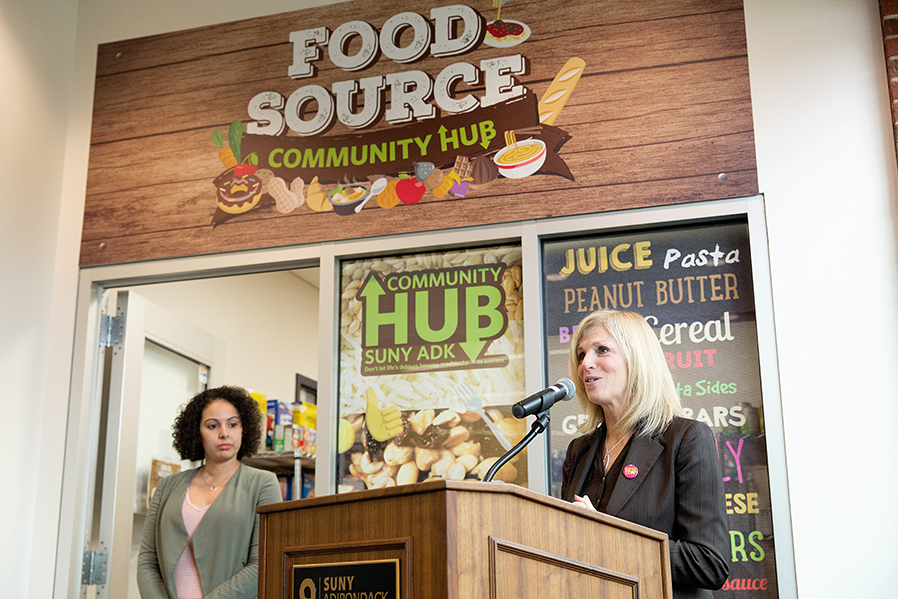 Dr. Kristine Duffy, right, and Community Hub Coordinator Yasmin Lopez officiate the grand opening of the Food Source in November 2017.