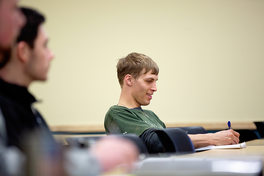 Agricultural Business student Ethan Smith takes notes during a class in Queensbury.
