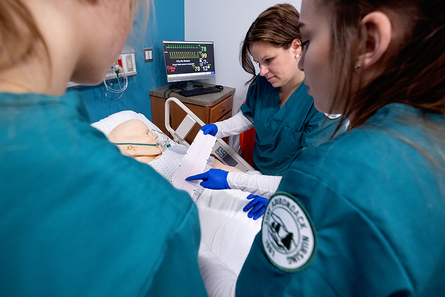 nursing students perform a practice exercise