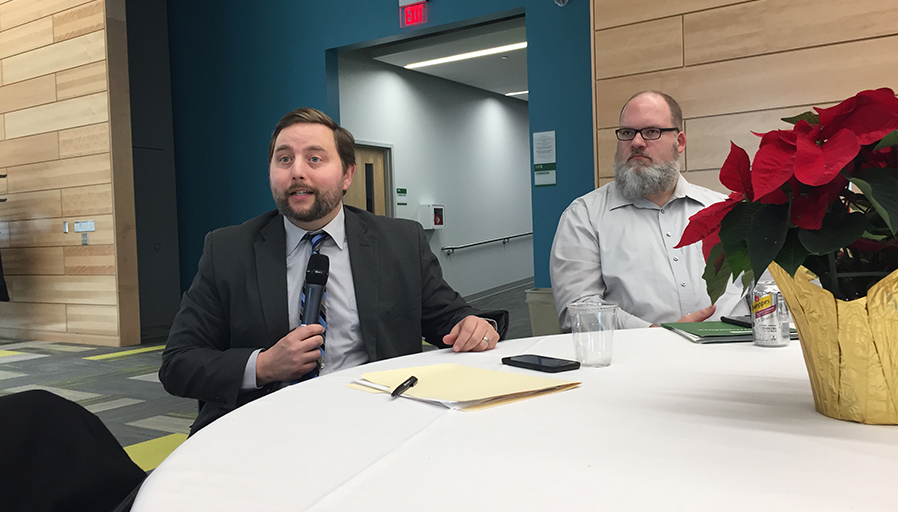 Robert Palmieri, vice president of Enrollment and Student Affairs, and Eric Conduzio, budget analyst, share information during a December Middle States meeting in the Northwest Bay Conference Center on the SUNY Adirondack campus.
