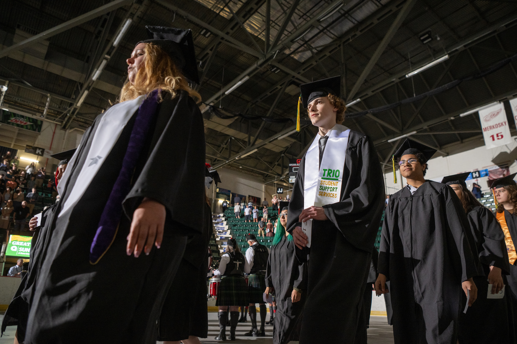 Graduates walk down the aisle during Commencement 2023.