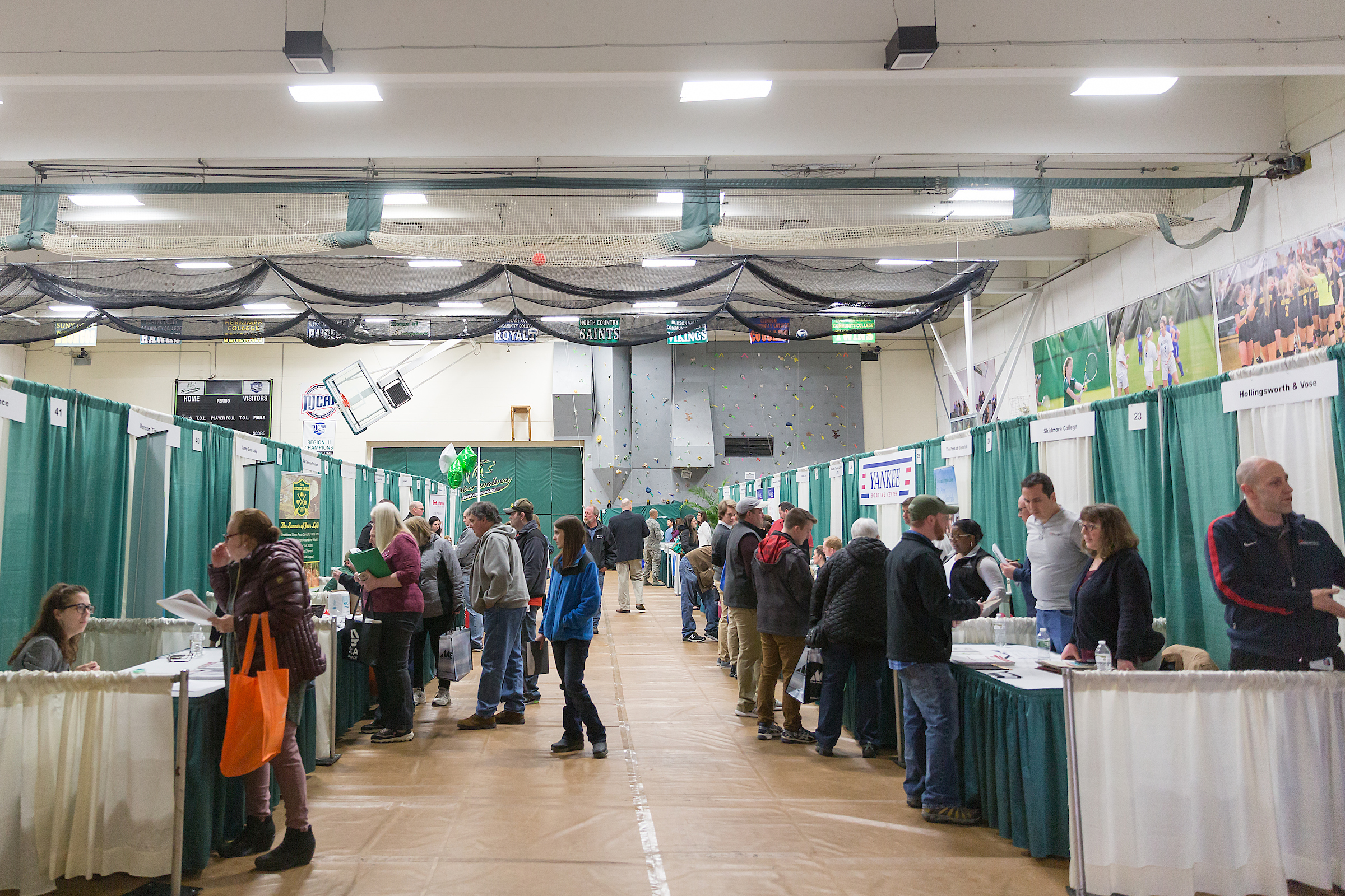 Participants in a job fair at SUNY Adirondack are shown among employer booths