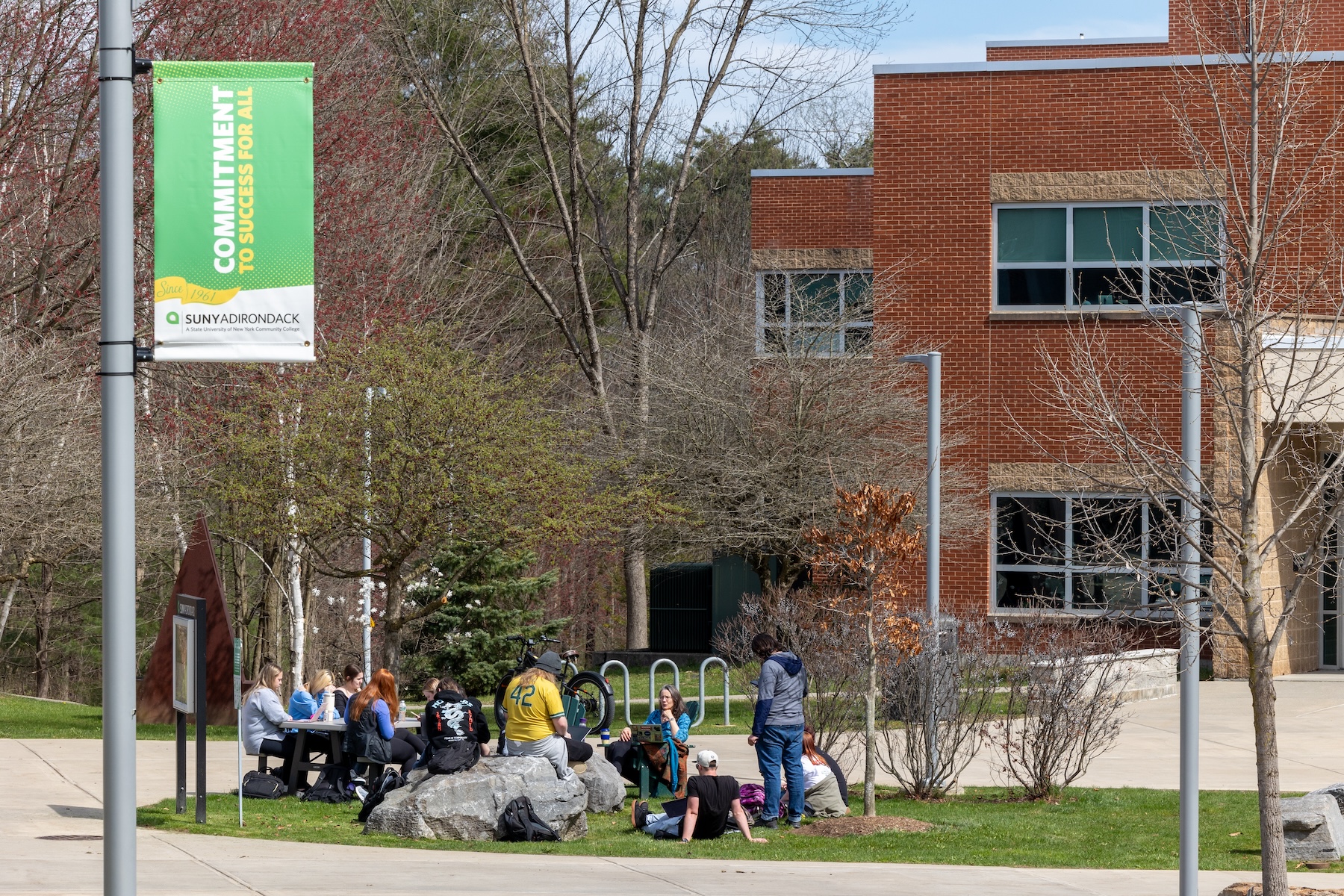 A group of students are seen outside on SUNY Adirondack's Queensbury campus