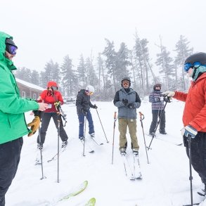 Students learning to downhill ski