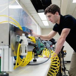 A student works in a Mechatronics lab at SUNY Adirondack