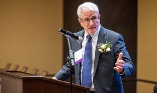Longtime SUNY Adirondack trustee Robert Judge accepts an award at NYCCT.