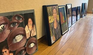 Student-created artworks line the wall of the Visual Arts Gallery, waiting to be considered for the annual Student Exhibition.