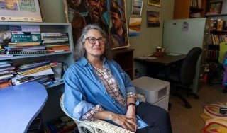 Distinguished Professor of English Kathleen McCoy is seen in her office