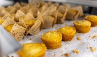 A line of cornbread muffins is seen on a counter at Seasoned