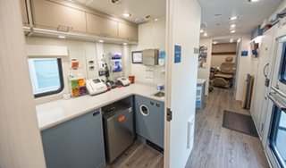 Interior of Hudson Headwaters Health Network Mobile Health Center includes exam rooms