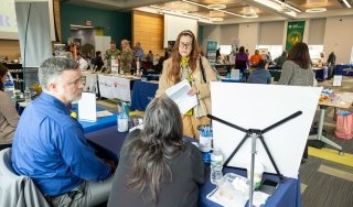 Job seekers mingle at a job fair at the college