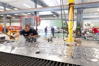 An employee is seen working at Fort Miller