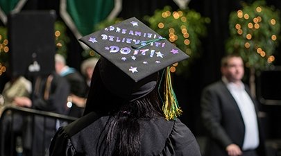 A graduation cap reads "Dream it, believe it, do it"