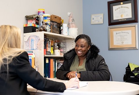 An adult student works with an advisor