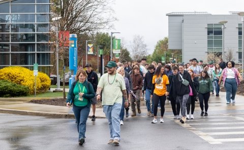 SUNY Adirondack campus and community members walk in the 2025 Walk Out of Darkness event on campus.