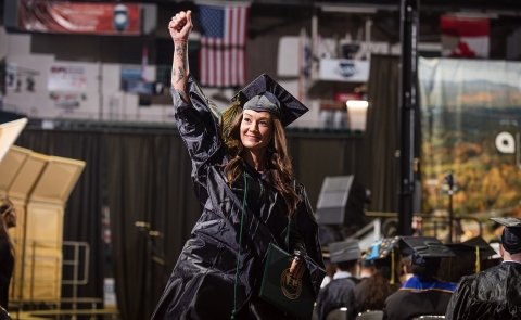 A graduate cheers after receiving their diploma at the 2026 commencement at Harding Mazzotti Arena.