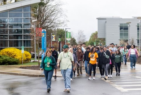 Community members walk through campus during the annual Walk from Darkness, a suicide awareness event
