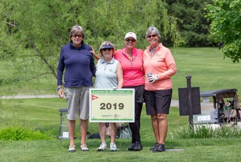 A group of four women pose for a photo during the 2019 tournament