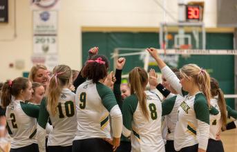 SUNY Adirondack's volleyball team gathers for a team huddle