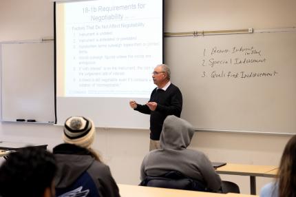 Professor John Arpey, J.D., teaches a class in Business Law