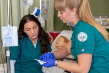 nursing students practice a procedure